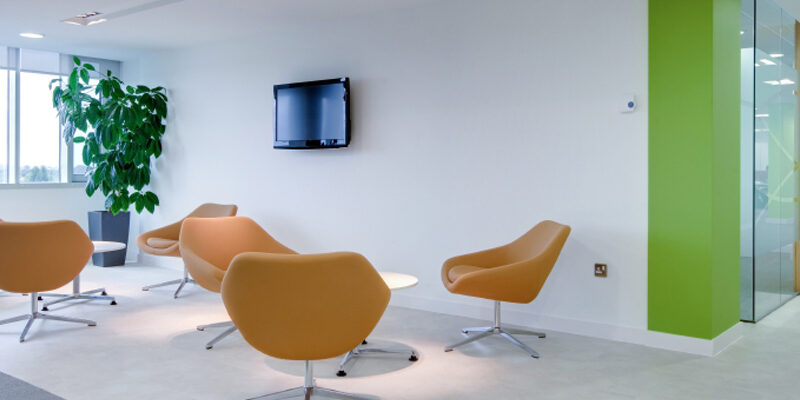 Brightly lit ultra chic reception area within modern commercial office